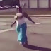 Watch the Hilarious Moment a Lady's Gigantic Boobs Popped-out from Her Dress While Dancing on the Road (Photos+Video)