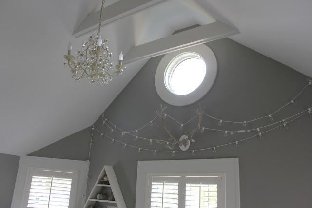 Round window detail in modern farmhouse bedroom on Hello Lovely Studio