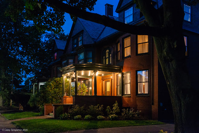 Portland, Maine USA September 2020. Photo by Corey Templeton. A well-lit porch and manicured lawn make for an inviting front yard on Vaughan Street.