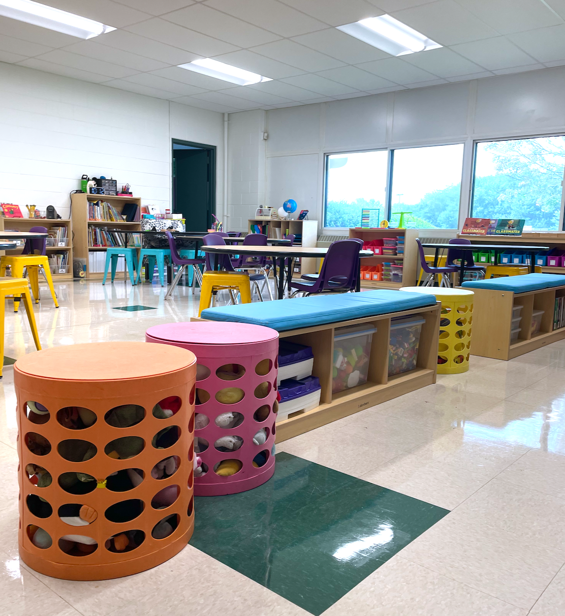 First grade classroom setup, featuring tables, alternative seating and organizational tips