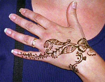Henna temporary tattoos and their roots