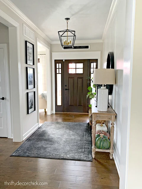 large foyer with craftsman door and windows