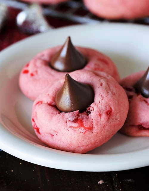 Close-Up of Cherry Kiss Cookie on White Dessert Plate Image