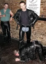 Slave bowing at Master's feet in public