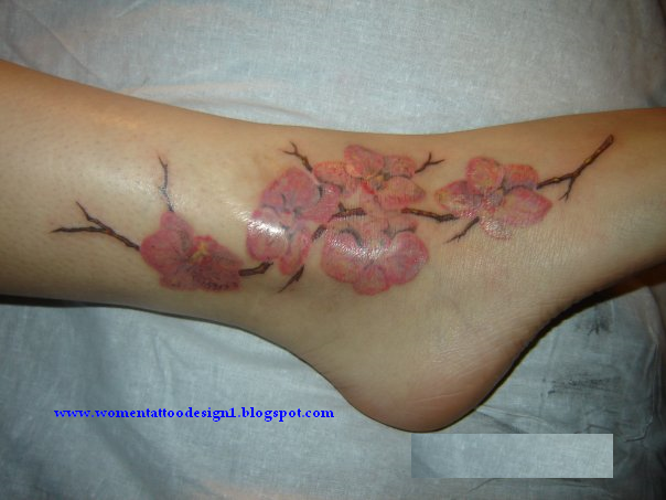 Experiment with the tattoo design have entwined vines with multiple flowers