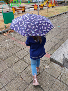 Rosie proudly with her umbrella