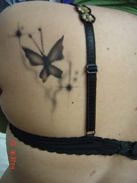 tattoos for girls upper back on Butterfly Tattoos on Upper Back for Girl | Tribal Tattoo Idea