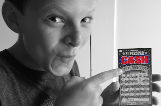 Kid Holding Lottery Ticket