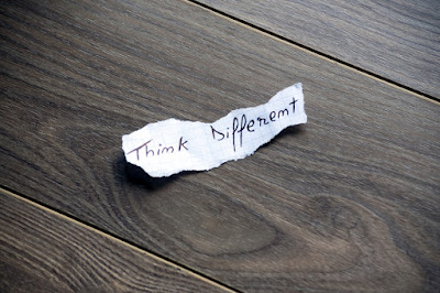 a scribbled note reads "Think different"