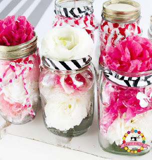 DIY flower centerpieces with pink and white flowers in mason jars
