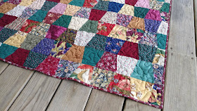 Tumbler quilt made with ugly fabrics