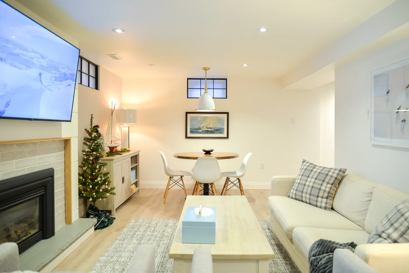 white basement family room with games table