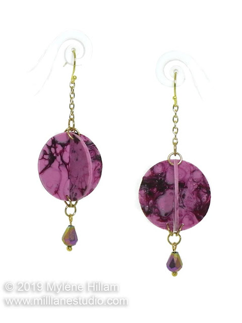 Pink and burgundy orb earrings with electroplated tear drop bead dangle.