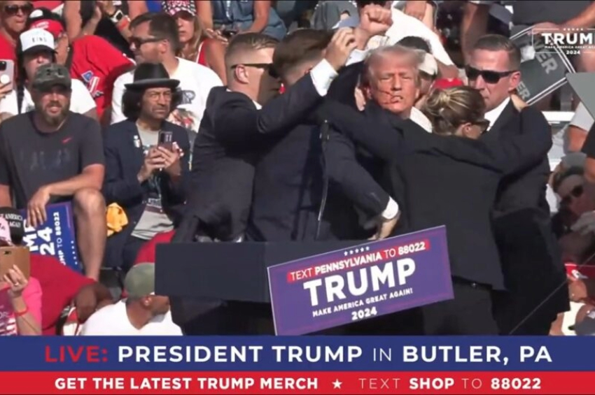 Com o rosto ensanguentado, Trump é cercado por agentes de segurança em comício na Pensilvânia | Foto: Reprodução