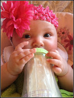 Baby Girl drinking from Playtex Bottle