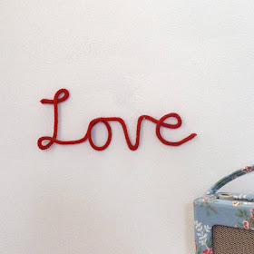 Knitted 'love' sign