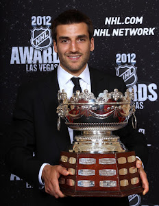 Patrice Bergeron with the Frank Selke Trophy for Best Defensive Forward in 2012