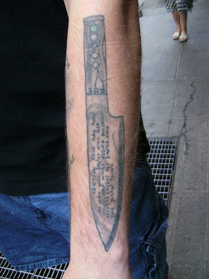 from – skulls, knives, broken hearts, Rose and dagger on forearm tattoo.