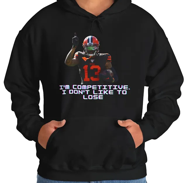 A Hoodie With NFL Player Odell Beckham Jr Raising His Finger Upward and Quote I'm Competitive I Don't Like to Lose
