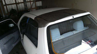 Trying to tint the back window. I did not manage. If not perfect it will have to do without.