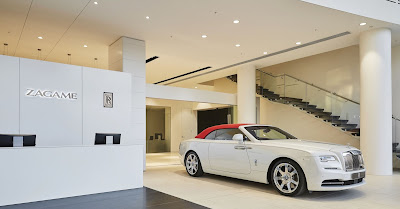 Source: Rolls-Royce Motor Cars. The reception area for the Rolls-Royce showroom in Melbourne with the limited edition commissioned Collection Rolls-Royce Dawn – Inspired by Fashion car finished in Andalusian White and Mugello Red on the right.