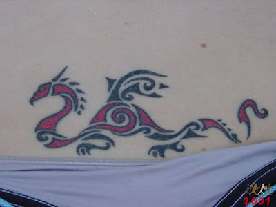 Lower back dragon tattoo