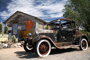 The humble motorcar has travelled a long way in a short time and many of us . (bigstock old car beside vintage house )