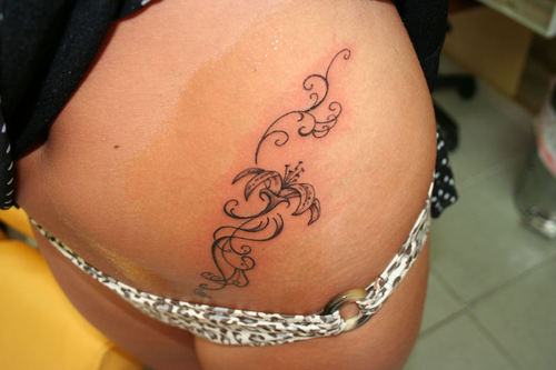 large lower back tattoos for women. Tattoos on the lower back area