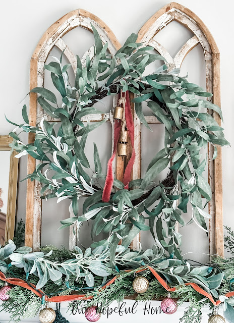 cathedral arches eucalyptus wreath blush velvet ribbon brass bells