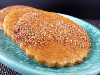 Round Cookies Covered with Cinnamon Sugar, on a teal plate