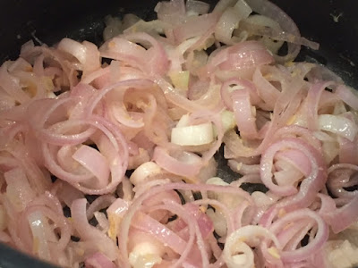 shallots and garlic softening in the pan