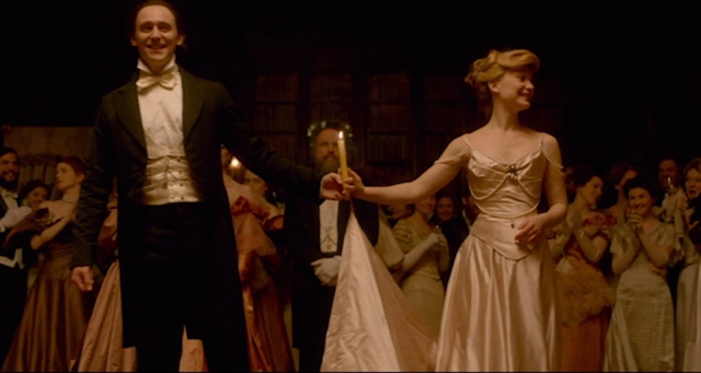 Thomas Sharpe (Tom Hiddleston) and Edith Cushing (Mia Wasikowska) finish the waltz in CRIMSON PEAK (2015).