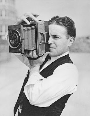 Man holds a camera
