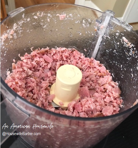 grinding up ham in a food processor