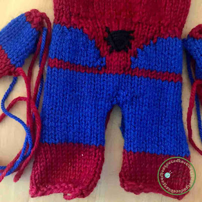 Picture of a close up of knitted spidermans body unstitched