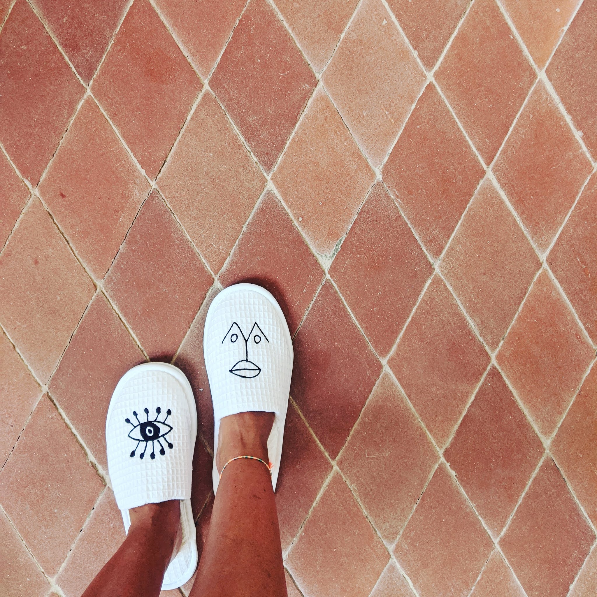 Slippers and terracotta tiles at menorca experimental