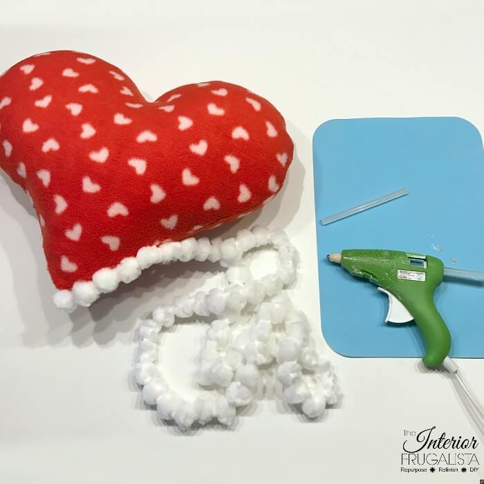 If you can sew a straight line then you can make this adorable fleece heart pillow for Valentine's Day in less than 15 minutes. Sewing machine optional!