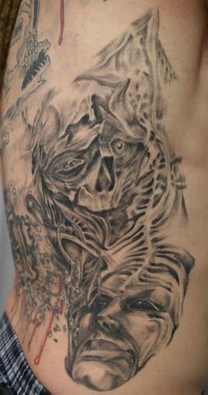 rib cage tattoos. Face Skull Rib Tattoo Design