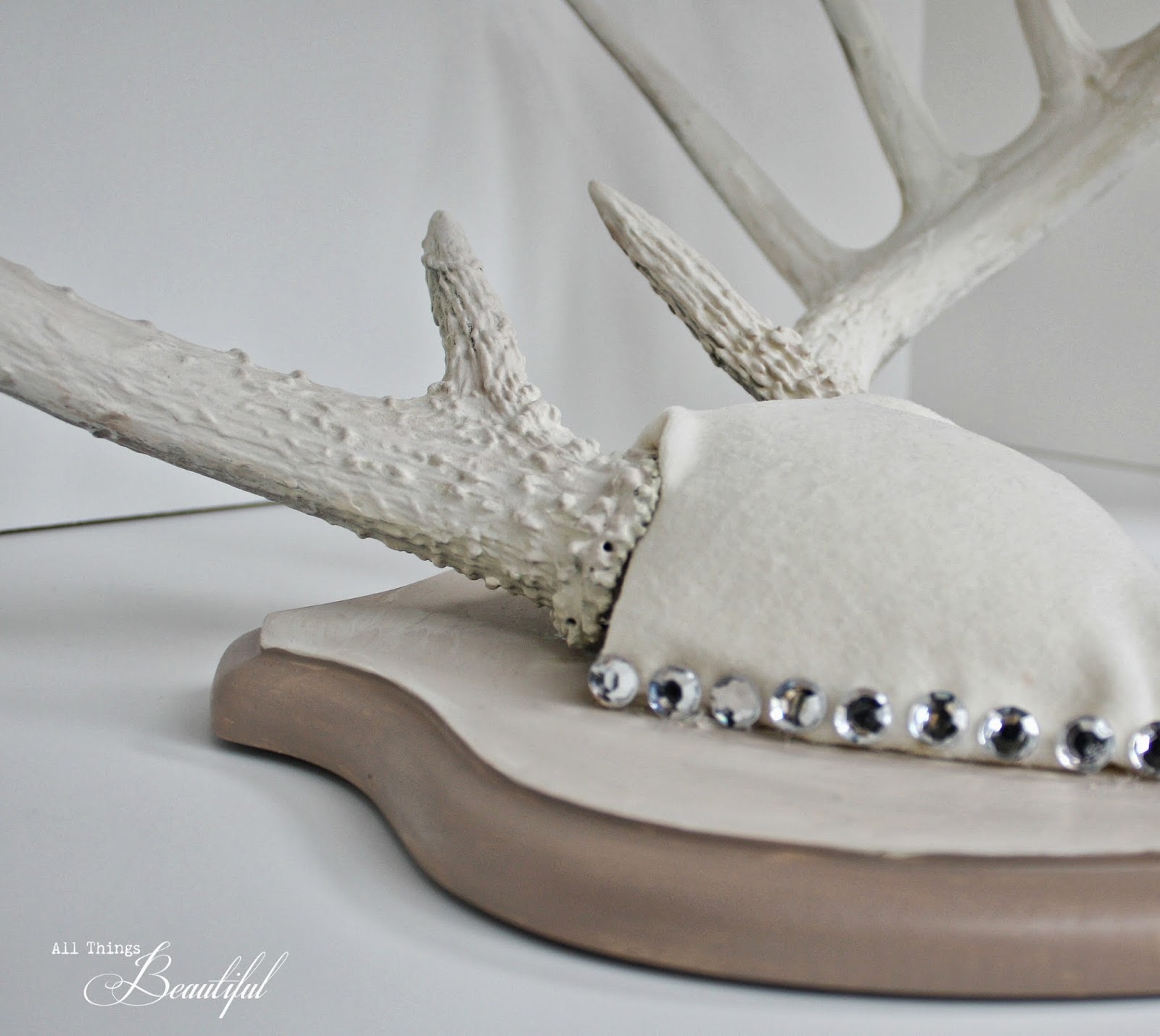 Why not take a regular mounted antler set and paint it to go along ...