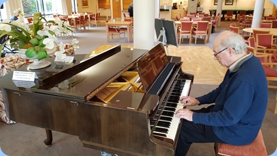 George Watt playing the Schimmel grand piano.