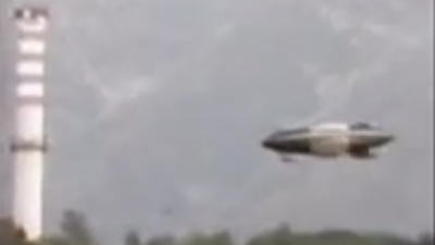 Italy silver metallic UFO sighting next to a river.