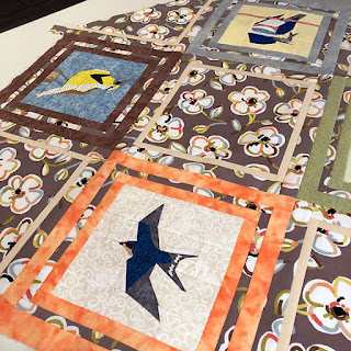 Table topper quilt made from bird quilt blocks