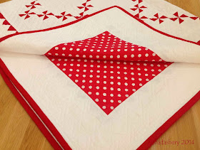 Red and White Pinwheel Quilt