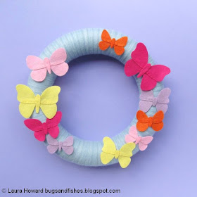 yarn-wrapped wreath decorated with felt butterflies