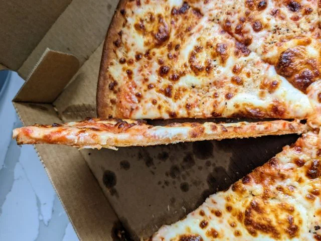 Papa Johns' New Crispy Parm Pizza Has Cheese At The Bottom