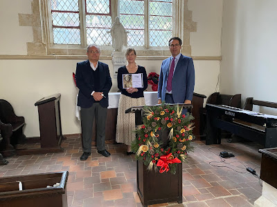 Feriköy Protestant Cemetery Initiative members Brian Johnson (left) and Richard Wittmann present the cemetery's ASCE membership certificate to the president of the governing board, Kirsten Thompson, U.S. Consulate, Istanbul.