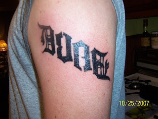 Ambigram Arm Tattoo Design