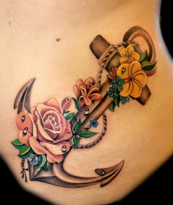 Realistic detailed anchor with roses tattoo on ribs