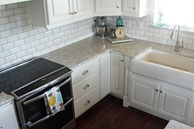Kithcen remodel with custom cabinets, beveled subway tile and Cambria Berwyn quartz