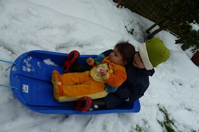 Snow day with children in the garden